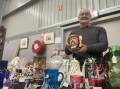 Stallholder Ken Smith with his wares at the Bendigo Collectors Fair. Picture by Gabriel Rule