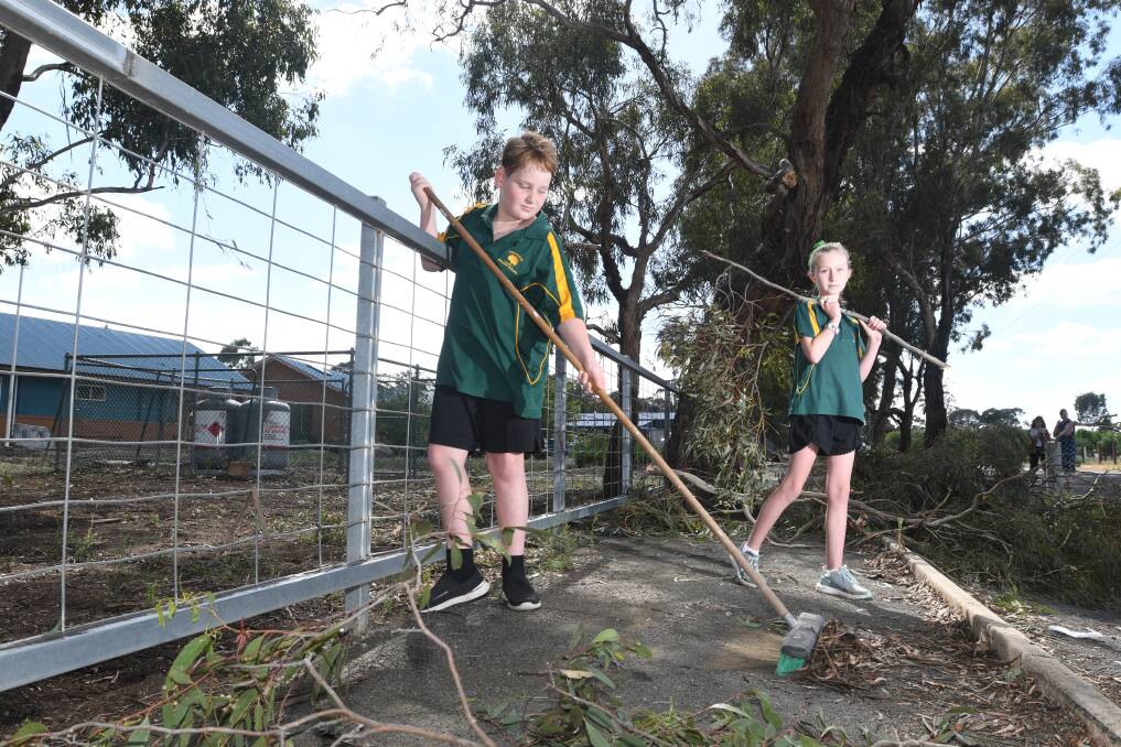 Lockwood Primary School students Tristan McClure and Brooke Soulsby volunteer to help prepare the school for this evening's Christmas Concert. Picture: NONI HYETT