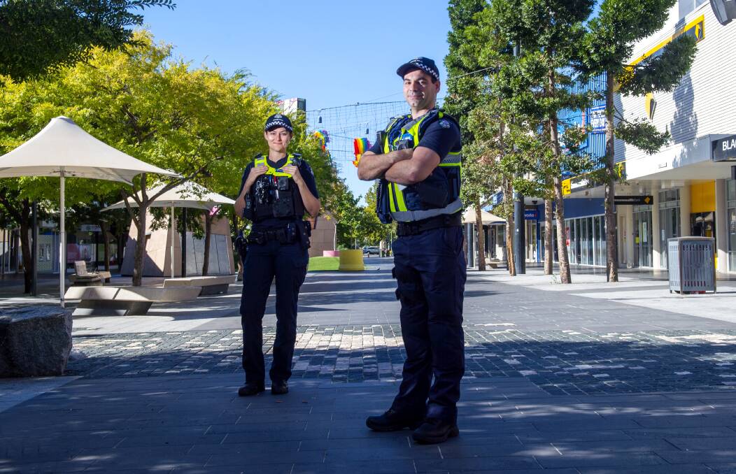 LOOKING OUT: Senior Constable Holly Lembke and Sergeant Mick Delaney in Hargreaves Mall on Tuesday. Picture: DARREN HOWE