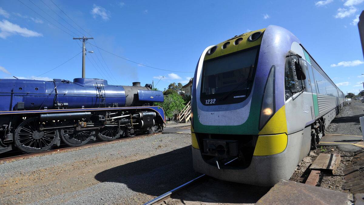 An old steam train beside a new V/Line train at the Bendigo train station. Picture: Julie Hough