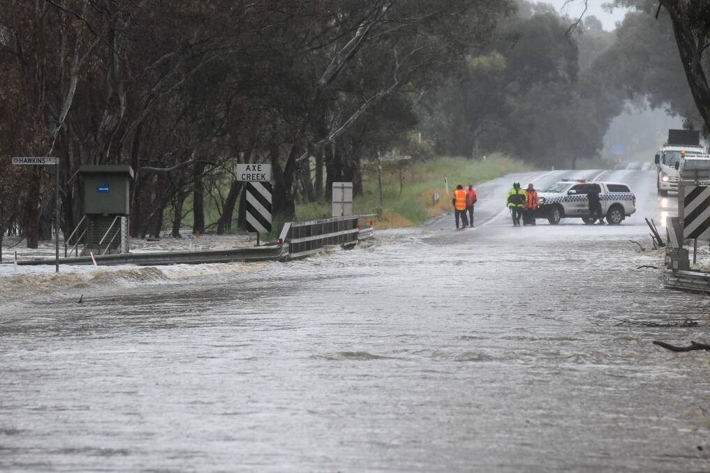 Water over McIvor Road at Axe Creek on October 13. Picture by Noni Hyett