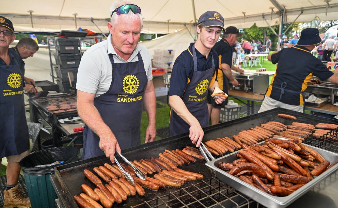 Allan Andrews and Cael Rainey cook up some snags at the Lake Weeroona Australia Day event. Picture by Enzo Tomasiello