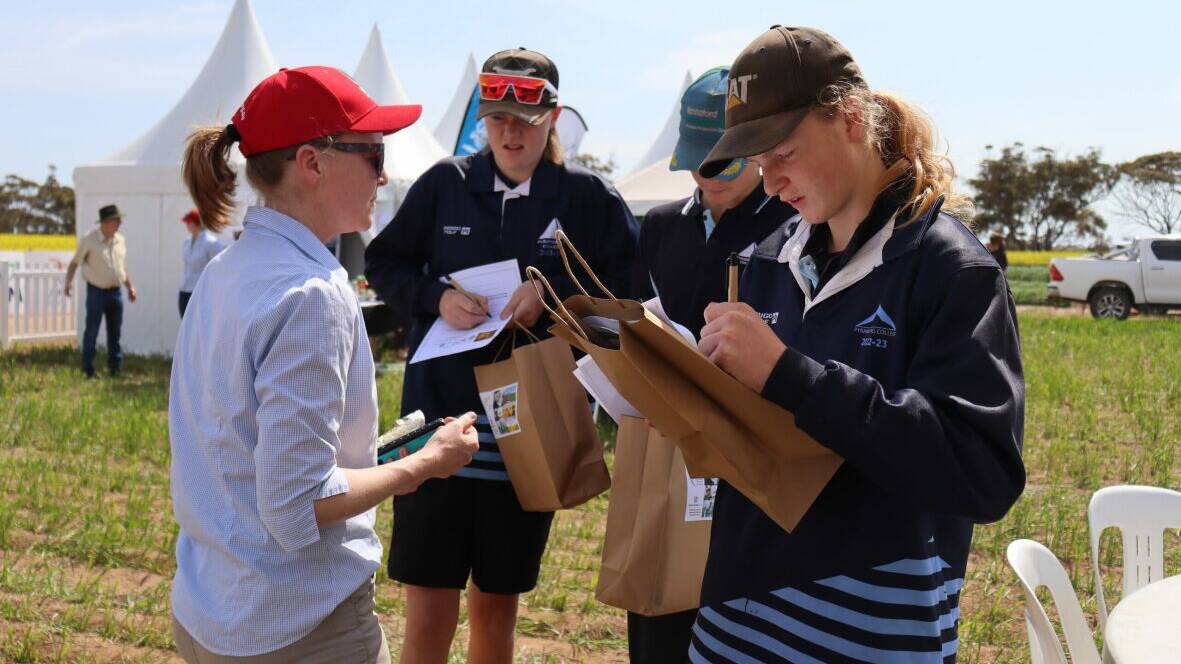 BCG's Louisa Ferrier helps secondary school students from Pyramid Hill with their Treasure Hunt questions at the BCG Main Field Day. Picture supplied.