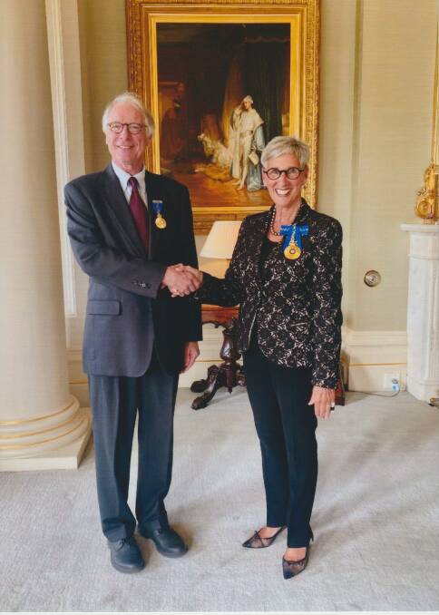Paul Kane receives his AM from the Governor of Victoria Linda Dessau. Picture supplied