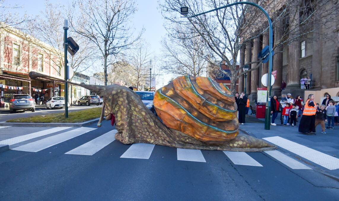 Mirabelle the giant snail stops traffic on View Street in Bendigo on Tuesday, July 2, 2024. Picture by Darren Howe 