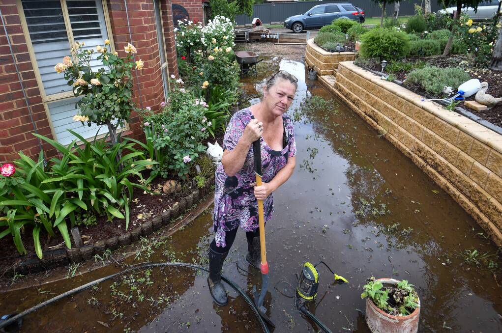 Debbie Dean cleaning up after the January 2024 floods. Picture by Darren Howe