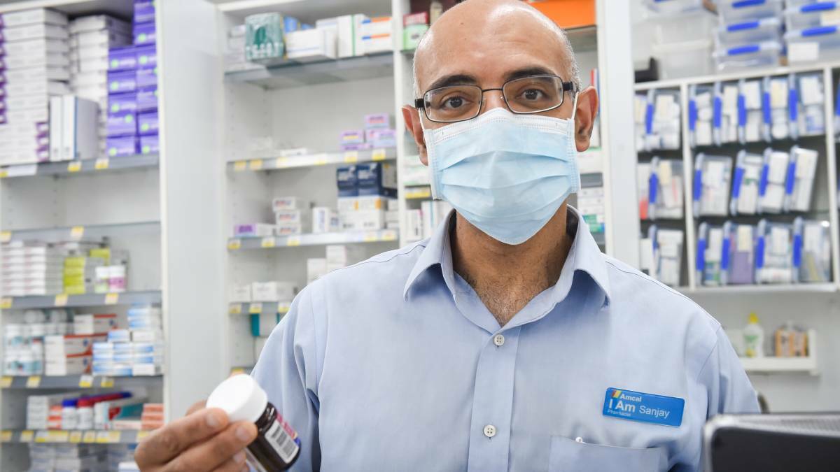 White Hills Pharmacy owner Sanjay Jhaveri, pictured during the height of the pandemic. Photo by Darren Howe 