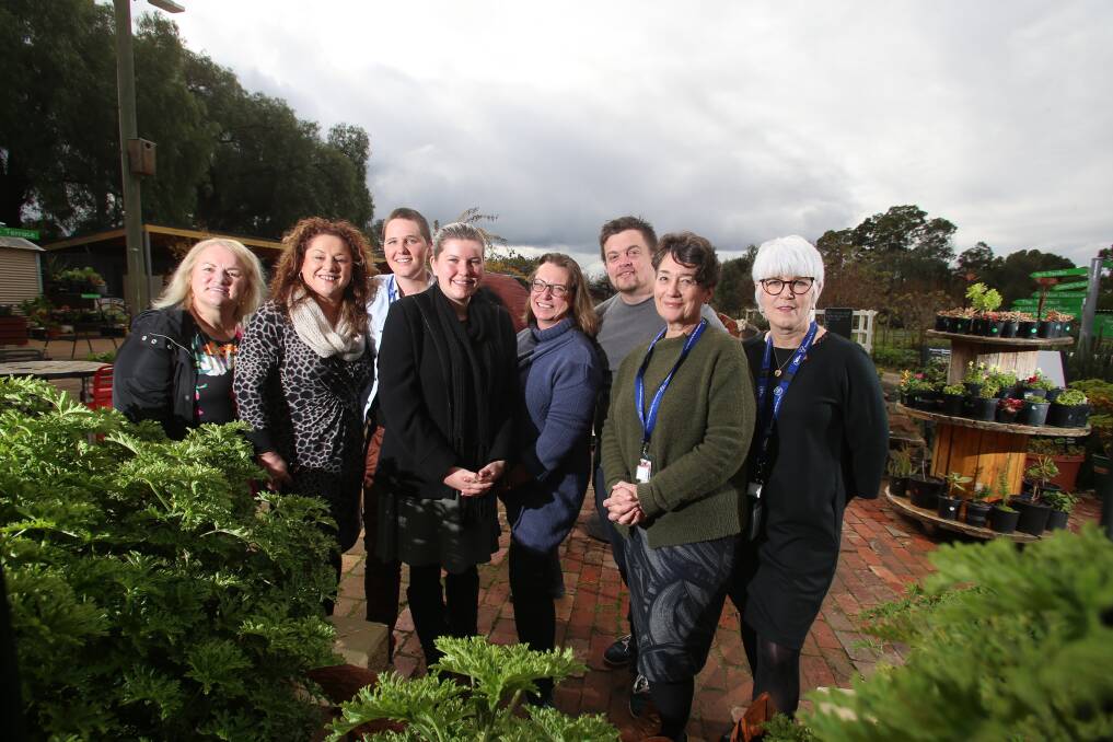Founder and CEO Elise Stewart (third from left, rear) with members of Bendigo's Deaf Hub at their PepperGreen Farm HQ in 2018. Picture by Picture: Glenn Daniels