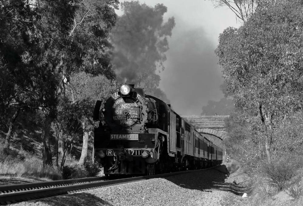 The Spirit of Bendigo engine and Steamrail train bearing the tribute to Graeme Kindon captured at Ravenswood during its trip to Bendigo on Sunday. Picture courtesy of Robert Lee Images. 