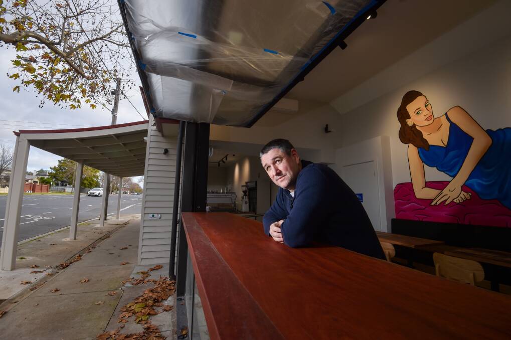 Owen Stuchbery at the window of his Golden Square cafe Madame Jude, which will open in July. Picture by Darren Howe
