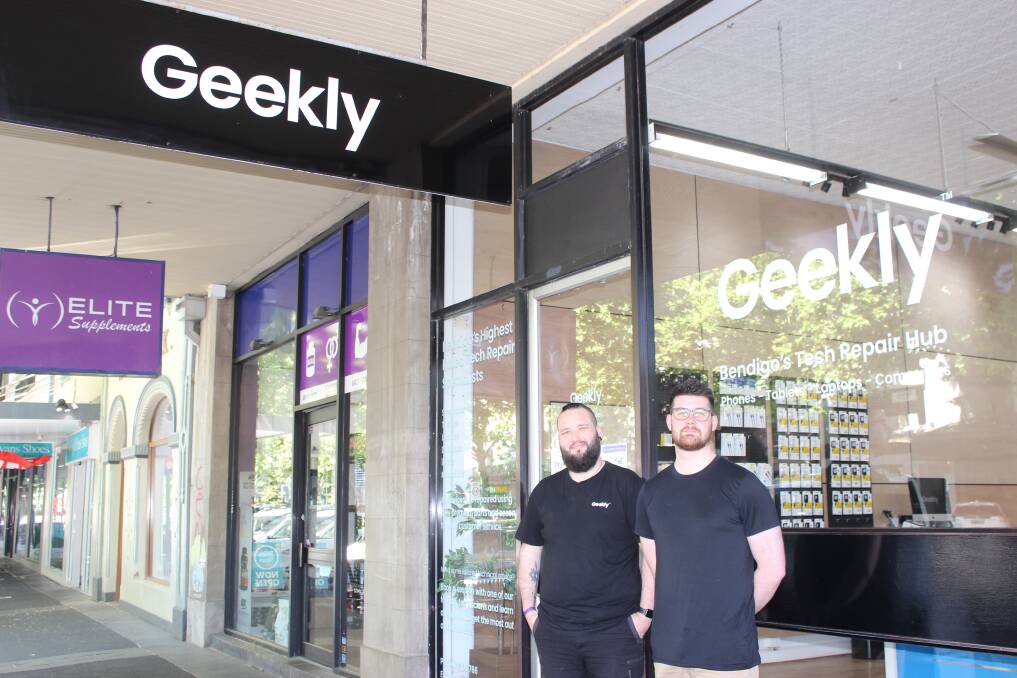 Angus Smith and Michael Lancaster from Geekly were getting a lot of inquiries about customers' "broken phones" this morning. Picture by Jenny Denton