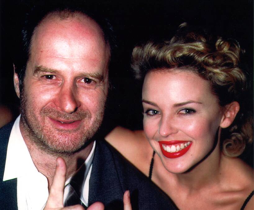 An image from The Michael Gudinski Story, which screens at Star Cinema on Friday night - taken with Kylie Minogue in 1994. Picture by Tony Mott 