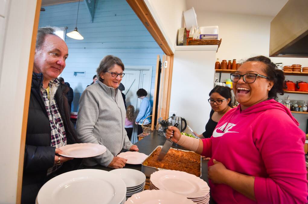 Aastha Rana serves up a community lunch at the Old Church on the Hill. Picture by Darren Howe
