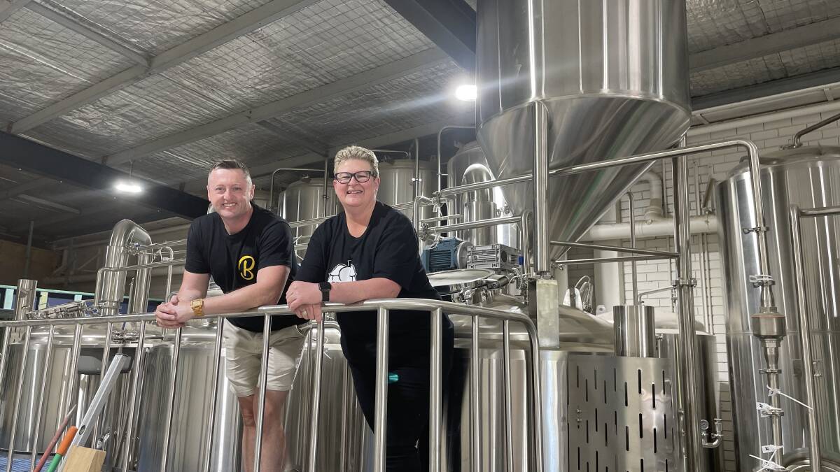 Bendigo Brewing's Trevor Birks and Mandy Cooper in front of the brewpub's tanks. Picture by Jonathon Magrath