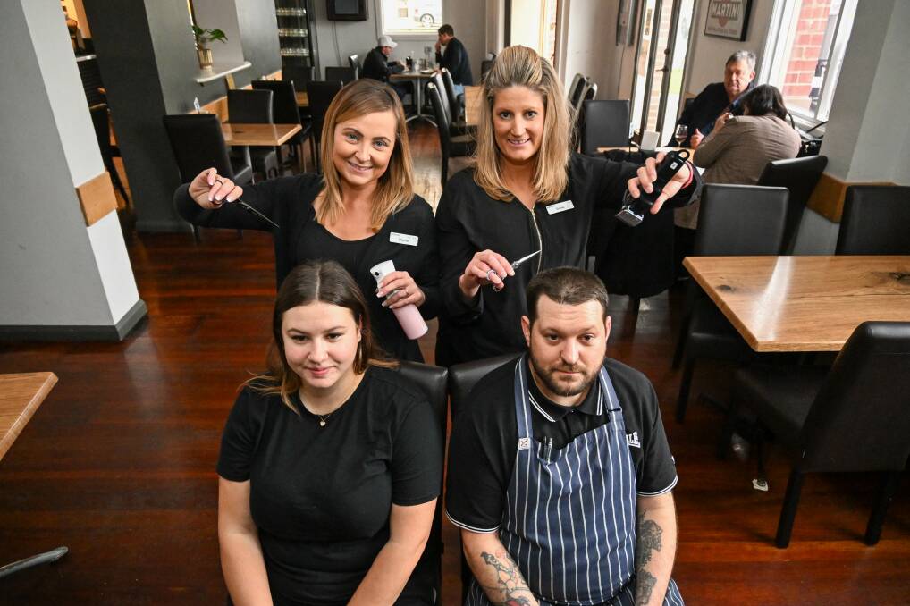 Just Cuts Bendigo hair stylists Shantel Morrison and Emma Kauter with Bridge Hotel staff Lisa Irwin and Hayden Rali. Picture by Enzo Tomasiello