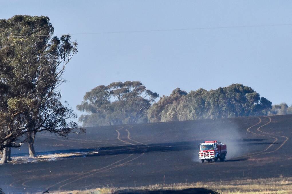 Crews battled a canola crop harvest fire at Murphys Creek on Tuesday, November 21. Picture by Darren Howe