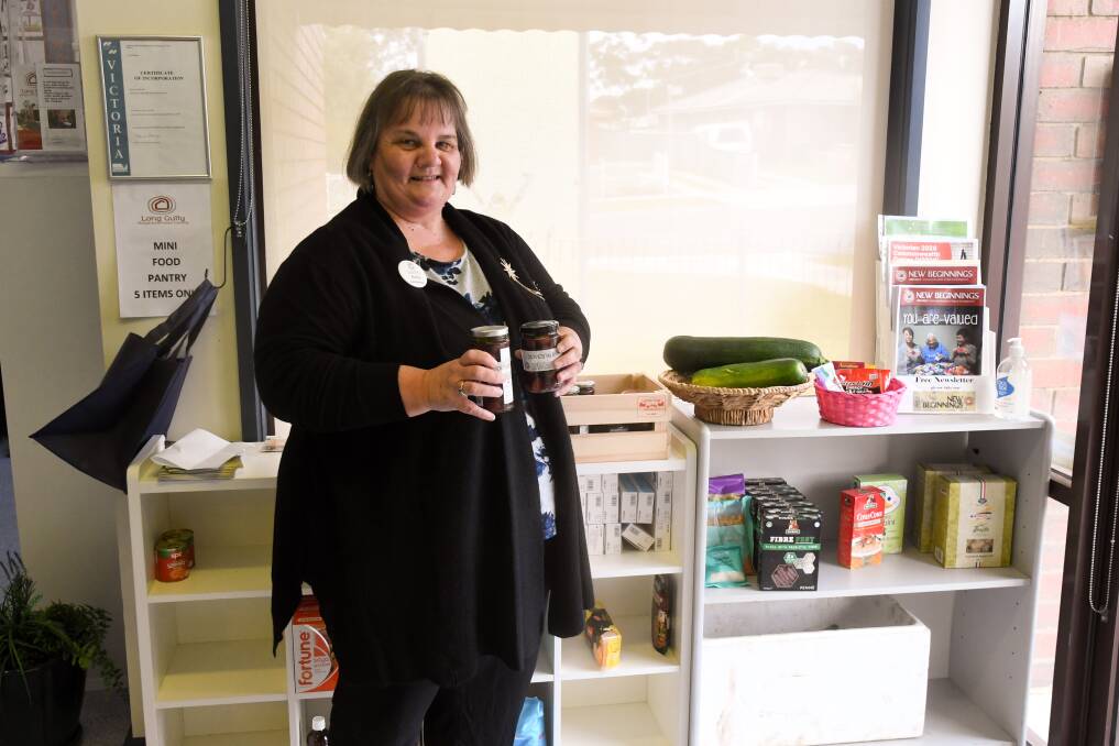 Long Gully Neighbourhood Centre co-ordinator Kerry Parry with the centre's "mini food pantry". Picture by Noni Hyett