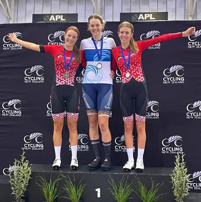 Lilyth Jones (centre) on the podium after collecting gold at the Oceania Track Cycling Championships. Picture by Bendigo and District Cycling Club Facebook. 