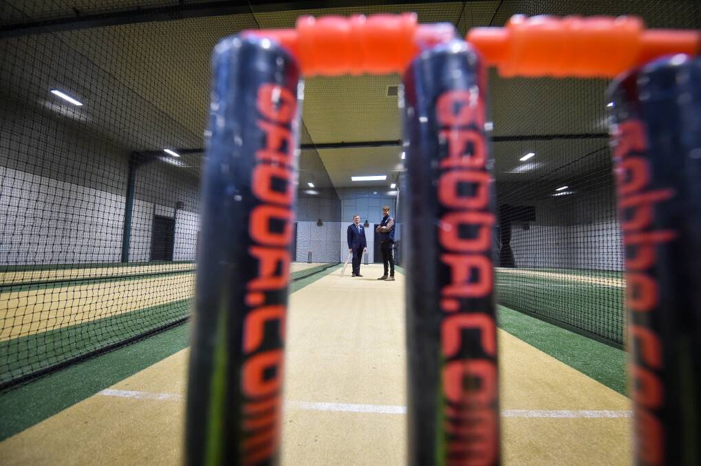 CMC principal Brian Turner (left) and Cricket Victoria talent development specialist stand mid-pitch in the new 'cricket hub' indoor nets. Picture by Darren Howe 