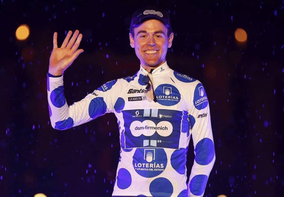 Chris Hamilton on stage accepting the King of the Mountain's jersey following his team stage one win at La Vuelta a Espana. Picture by Team DSM 