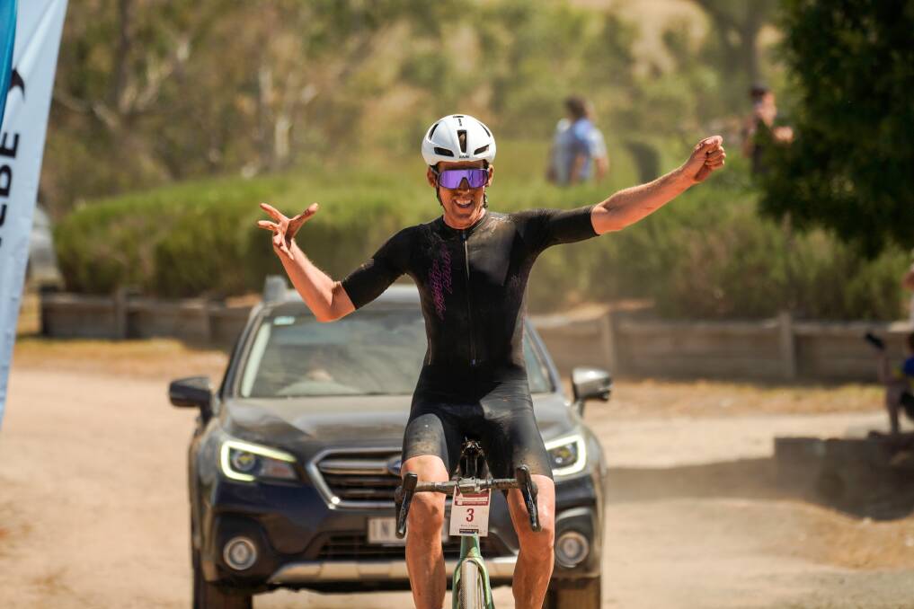 Inaugural Sutton Grange Winery Uncorked Gravel winner Mark O'Brien celebrates as he crosses the line solo. Picture by Henry Yates 6ft8 photographrer 