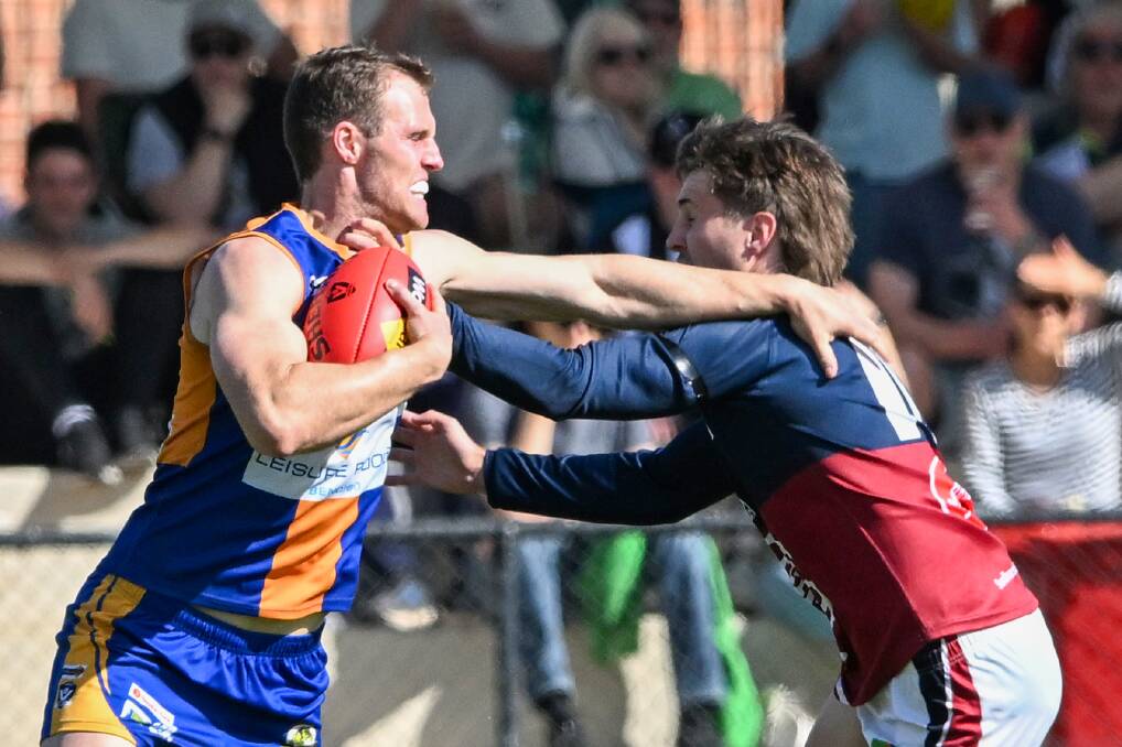 Barrett fends off Tanner Nally. Picture by Darren Howe 