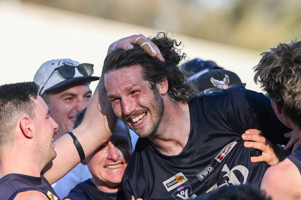 Mount Pleasant skipper Chris Down is mobbed by teammates after he was announced as best-on-ground in the 2023 HDFNL grand final. Picture by Darren Howe 