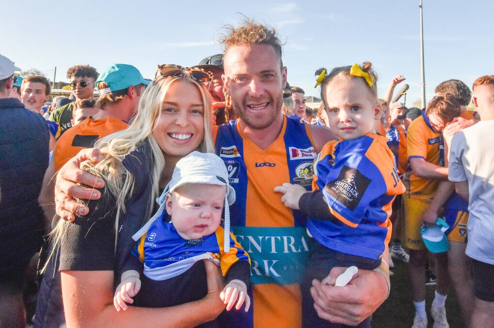 Jack Geary celebrates with his family following the Bulldogs six-point grand final win over Sandhurst. Picture by Darren Howe 