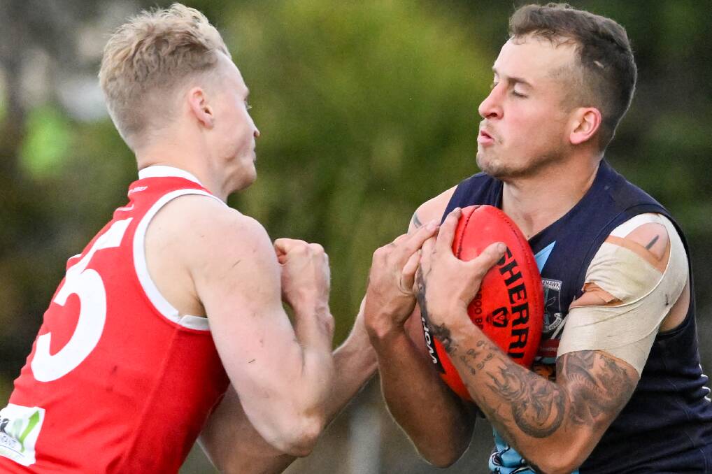 Wheeler readies himself for a collision with South Bendigo's Samuel Langley. Picture by Darren Howe 