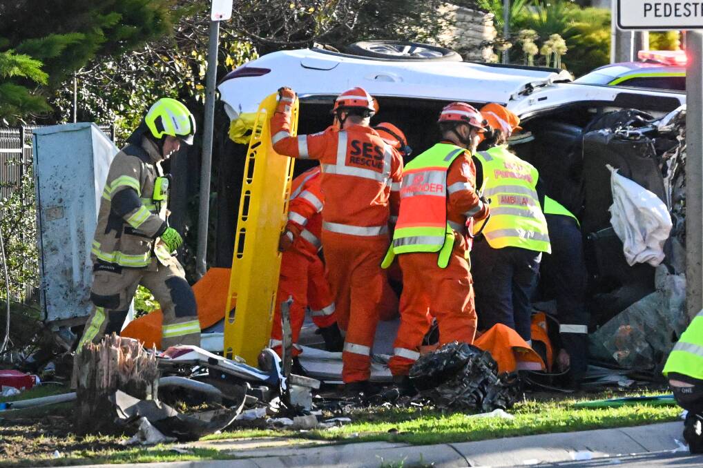 Emergency services attend to the white SUV involved in the crash on June 9 at McIvor road. Picture by Darren Howe
