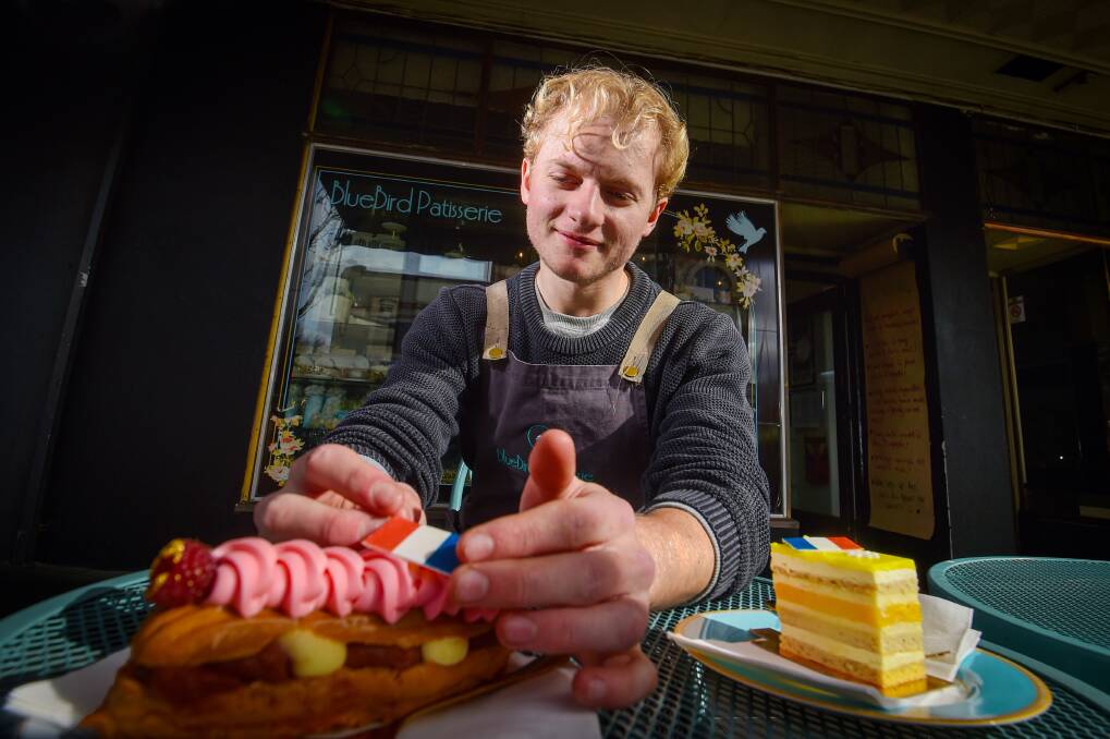 Isaac Richardson from Bluebird Patisserie gets Bastille Day ready. Picture by Darren Howe