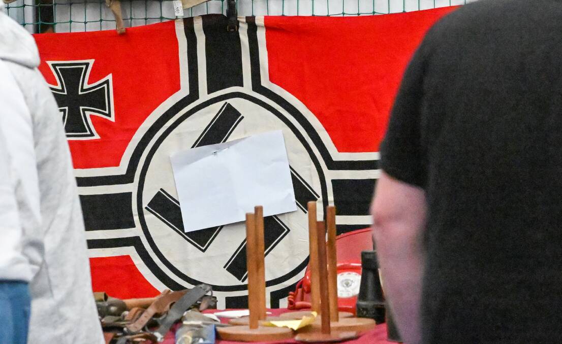 One of the flags had the swastika partially covered. 