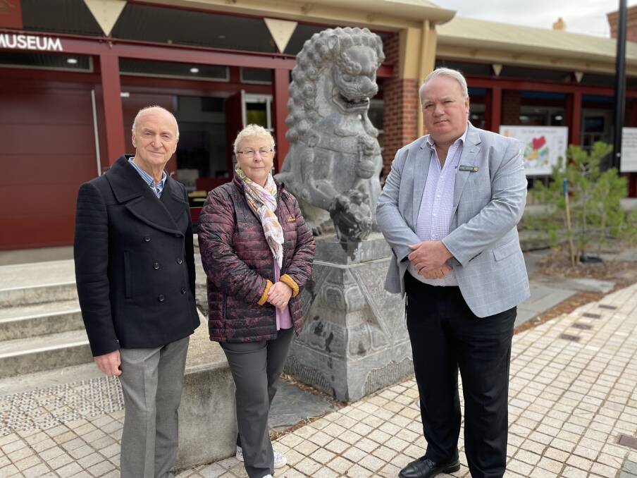Great Stupa's Ian Green, City of Greater Bendigo Mayor Andrea Metcalfe and GDM CEO Hugo Leschen beside one of the affected statues. Picture by Ben Loughran 