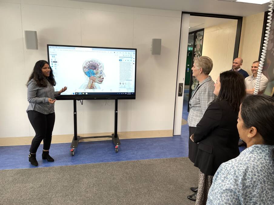 Biomedical Science student Sanjana Jijo showing how the technology in the new hub works. Picture by Alex Gretgrix