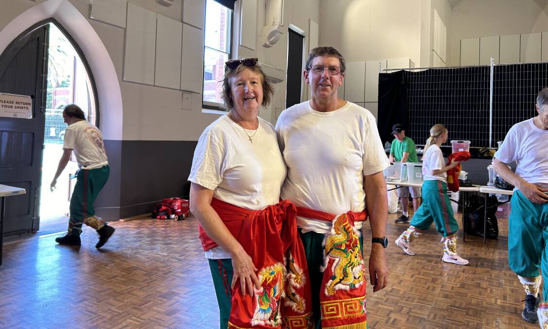 Judy Deveraux and Rodney Pierce in their Dai Gum Loong costumes. Picture by Georgina Sebar