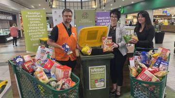 (From left) Woolworths assistant store manager Nick Davies, Bendigo Marketplace manager Danielle Tait and Bendigo Foodshare CEO Michelle Murphy at the Winter Food Drive launch on July 25. 