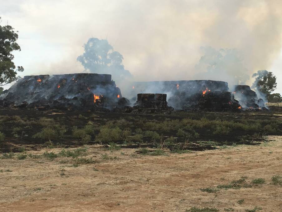 Three hay stacks - consisting of 2100 bales of hay - caught alight at Mincha West. Picture: CONTRIBUTED