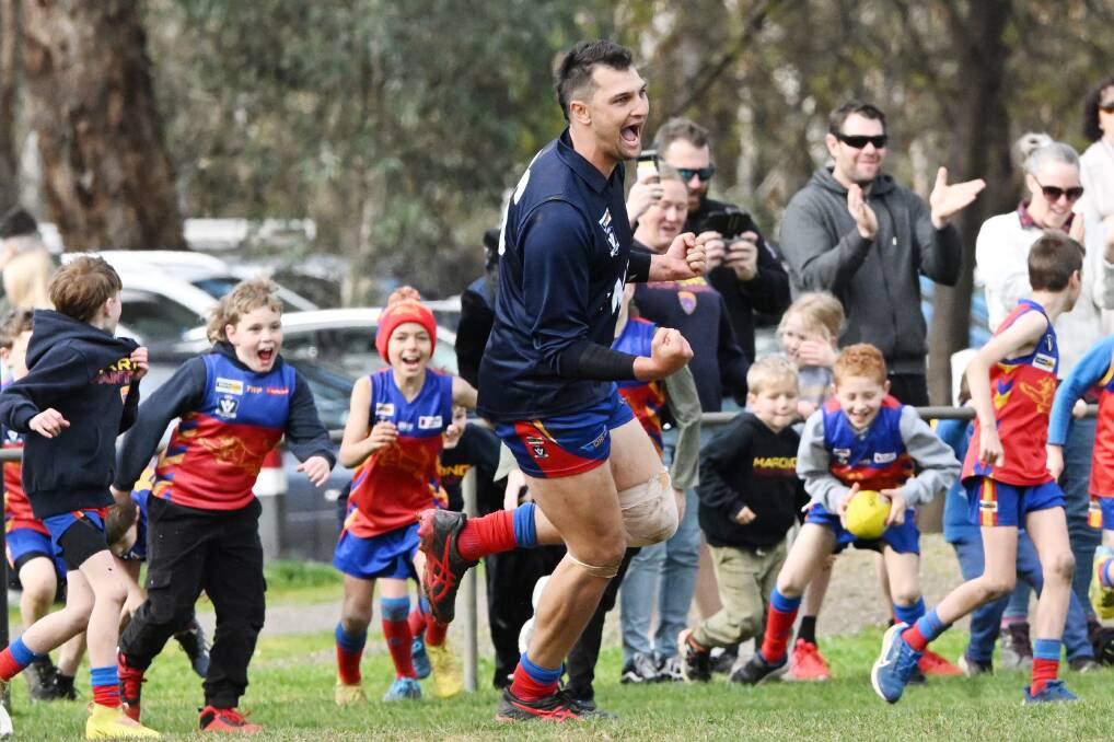 Marong forward Brandyn Grenfell is about to be swarmed by young Panthers' supporters after kicking his 100th goal of the season on Saturday. Picture by Darren Howe