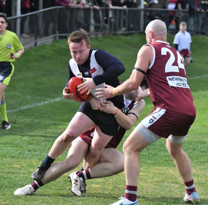 Inglewood's Jack Nevins is tackled during Saturday's 44-point win over Newbridge at Riverside Park in round 16 of the LVFNL. Picture by Adam Bourke