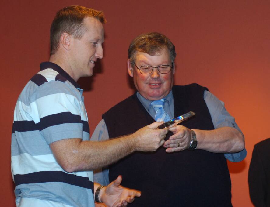 Gary Piggott presents Ben Smith with an award at the BDCA presentation night in March of 2007.