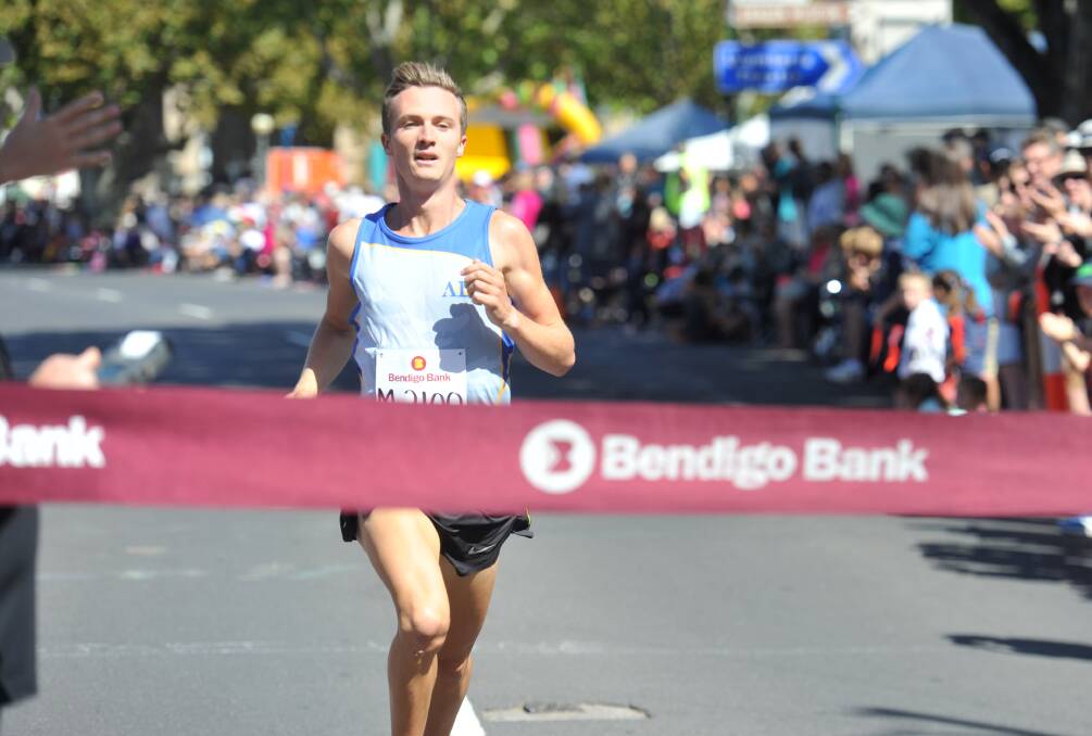 HEADING OVERSEAS: Andy Buchanan, who is preparing to compete in America, wins last year's Bendigo Bank Dragon Mile. Picture: NONI HYETT