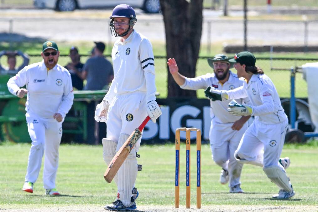 Bendigo opener Kieren Burns is caught by Campbell Smith in the second innings against Kangaroo Flat - one of 19 wickets the Goers lost for the day. Picture by Darren Howe