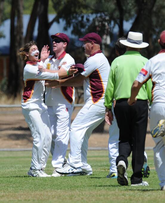ROCKET ARM: Maiden Gully's Darcy Poulter is congratulated after his throw that ran out Golden Gully batsman Greg Thomas for five on Saturday on the final day of the EVCA home and away season. Picture: NONI HYETT