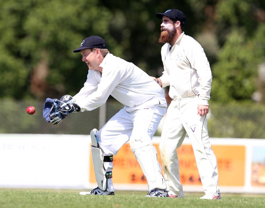 VETERAN: Eaglehawk wicket-keeper Matt Fitt watches the ball into his gloves during Saturday's victory over Strathfieldsaye. Fitt took two catches.