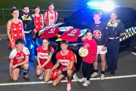 Footballers and netballers from South Bendigo with constable Brennan Walters and leading senior constable Dale Andrews ahead of Road Safety Round. Picture by Enzo Tomasiello