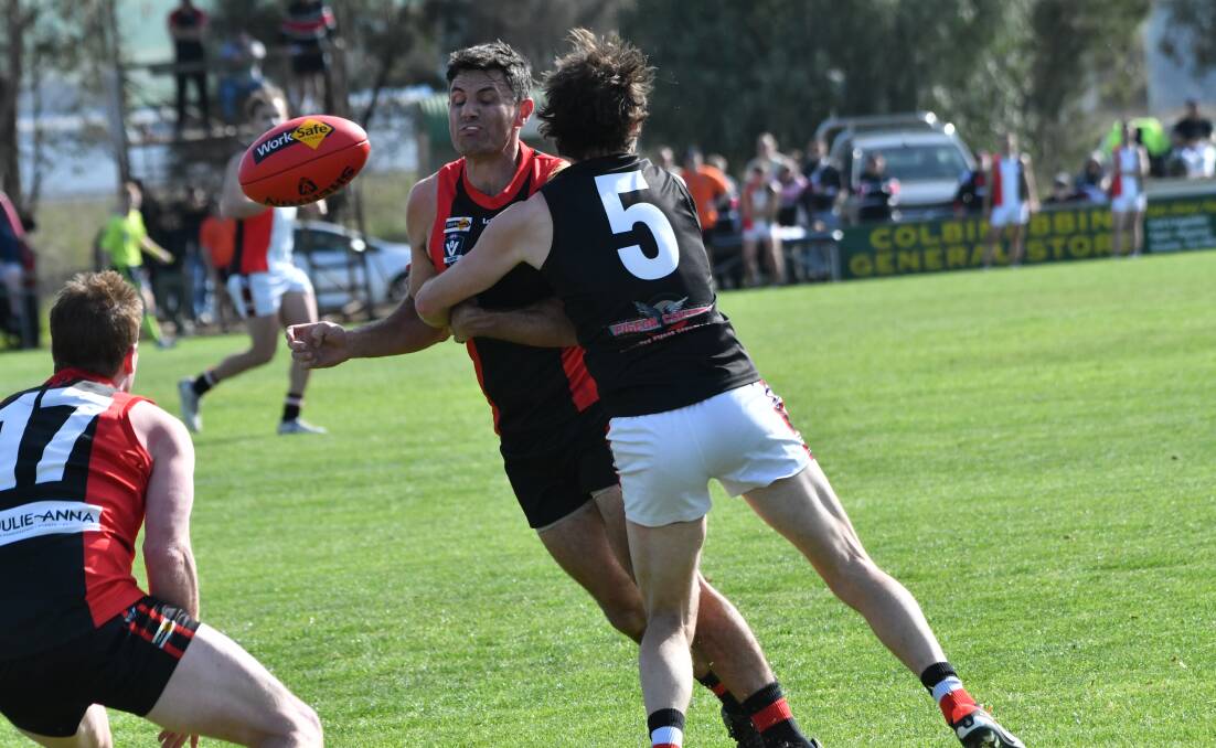 Hard-at-it midfielders Brady Childs (White Hills) and Liam Jacques (Heathcote) compete against each other on Saturday. Picture by Luke West