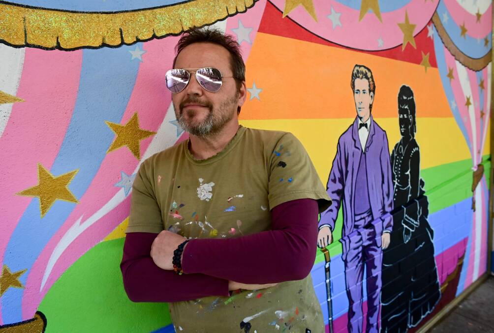 PRIDE ON SHOW: Artist Chris Duffy with his Chancery Lane mural of trans man Edward de Lacy Evans. The artwork has been created for the Bendigo Pride Festival. Picture: BRENDAN McCARTHY