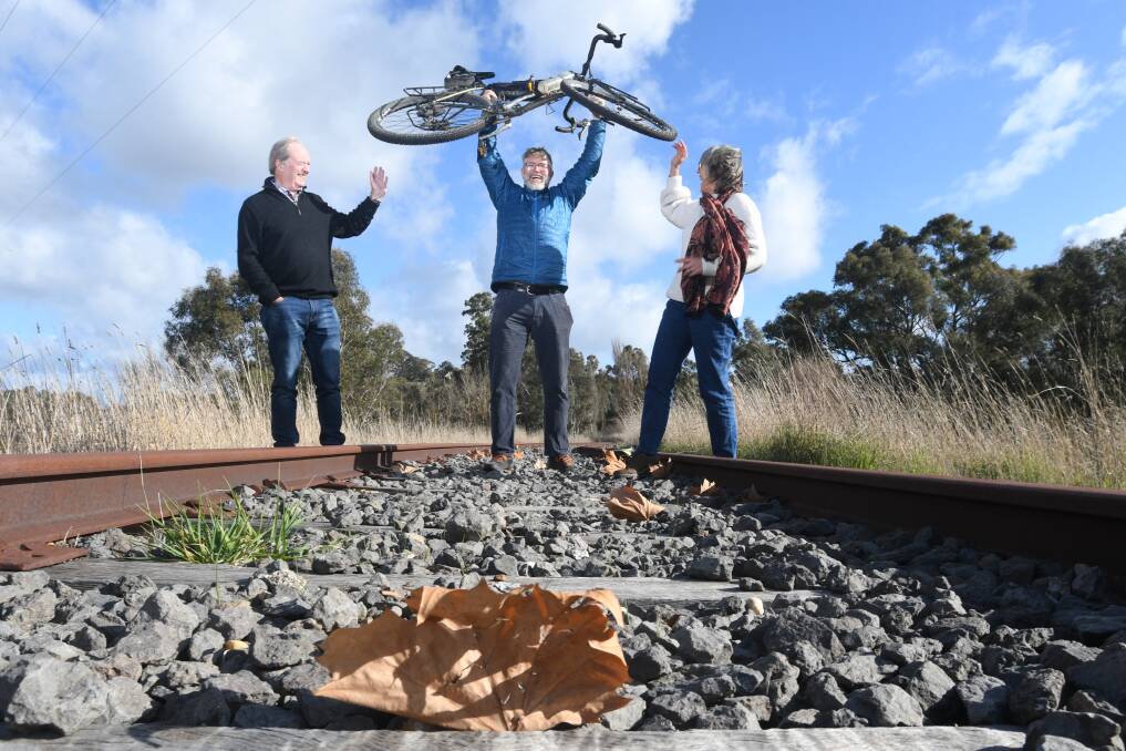 Geoff Hooke, Sandy Harman and Deb Macer on the proposed route of the Castlemaine-Maryborough Rail Trail. Picture by Noni Hyett