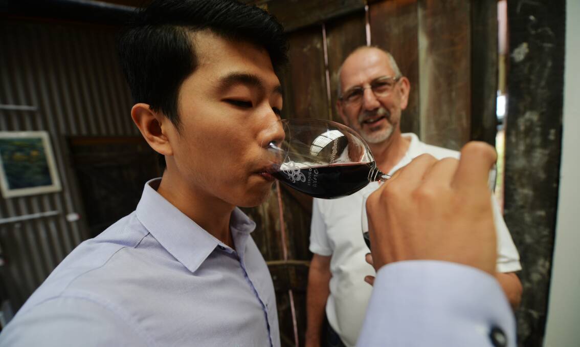 2016: Winemaker Peter Fyffe watches as Melbourne University's Dr Pangzhen Zhang hunts for a peppery flavour prized by Chinese connoisseurs. Picture: DARREN HOWE