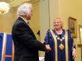 Cr Rodd Fyffe passes the batton to new mayor Cr Lisa Ruffell in 2012. Picture by Jim Aldersey